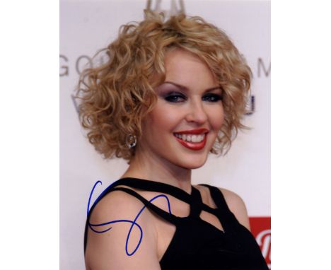 MINOGUE KYLIE: (1968-     ) Australian Pop Singer. Two signed colour 8 x 10 photographs, the first depicting Minogue in a hea