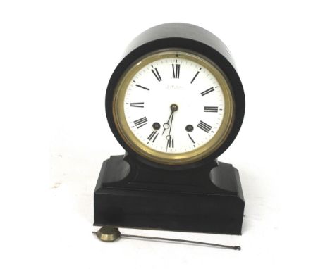 A 20th century black slate pendulum mantle clock. The white enamel dial with Roman numerals, H34.5cm