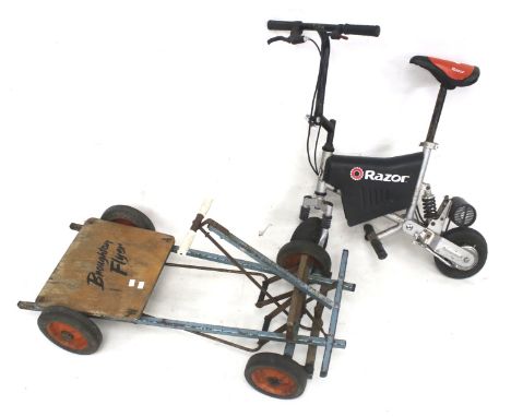 A pedal kart and a Razor electric scooter. The blue framed cart marked 'Broughton Flyer', L98cm