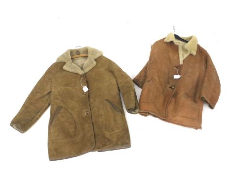 Two vintage sheepskin coats. One with a brown leather exterior, W42cm