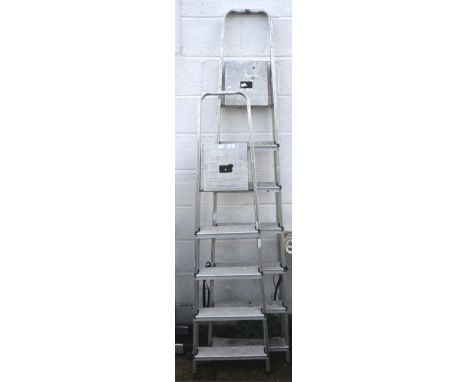 Two assorted aluminium step ladders.