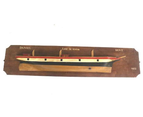 A 20th century half-hull model. Marked 'Daniel, Lost in Storm, Hove, 1922', L137cm