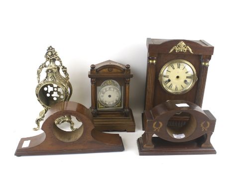 Five 19th century and later mantle clock cases. Including a gilt example and two with inlaid details, Max. H34cm