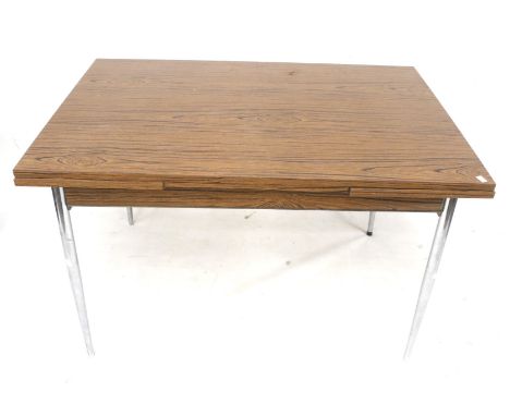 A French 1960s draw leaf table with tapering chrome legs. L120cm x D80cm x H74cm Condition Report: General condition fair for