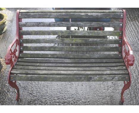 A two seater garden bench with cast metal ends. 106cm long