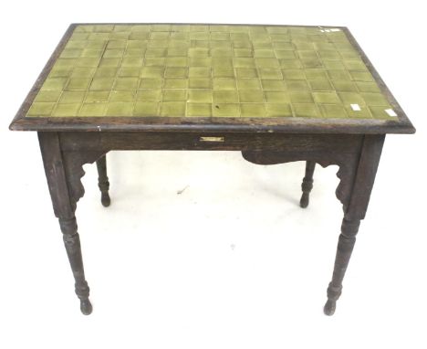 A vintage green tile top oak table. Raised on turned tapered supports, H73cm x W85cm x D56.5cm