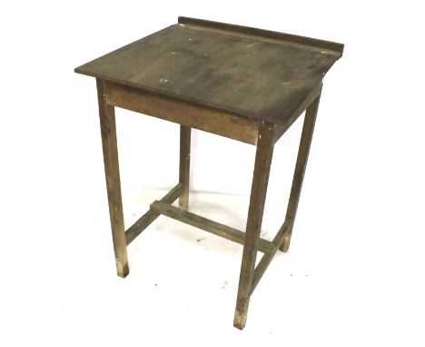 A vintage oak clerks writing desk. With a hinged lid, mounted on square supports. L80cm x D72cm x H116cm