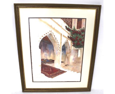 A signed limited edition print. Depicting a Middle Eastern courtyard scene with rugs on the floor, numbered 9/150, signature 