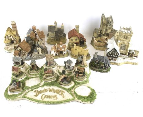 A collection of David Winter model cottages. Some with the original boxes