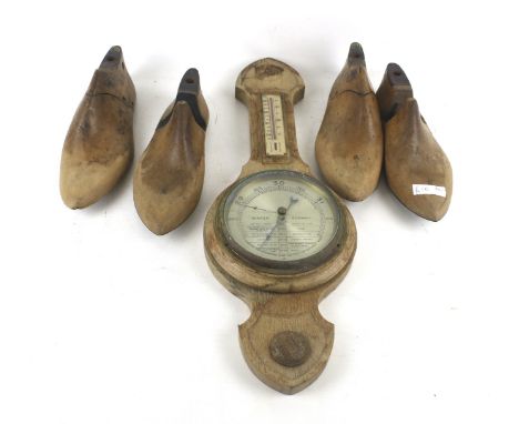 Two pairs of vintage wooden shoe lasts and a barometer. 
