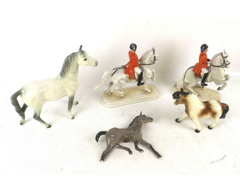 An assortment of porcelain horses. Comprising two Spanish horsemen of Vienna mounted on horseback figures, two Goebel figures