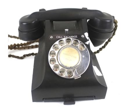 A vintage telephone. In a black bakelite case, H15cm