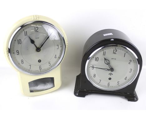 Two Mid-century clocks. Comprising a Smiths mantle clock, the silvered dial with Arabic numerals, in a brown bakelite case, H