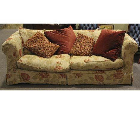 A two part Chesterfield sofa/settee. With feather stuffed cushions and tetrad treated floral cover and assorted cushions. L22