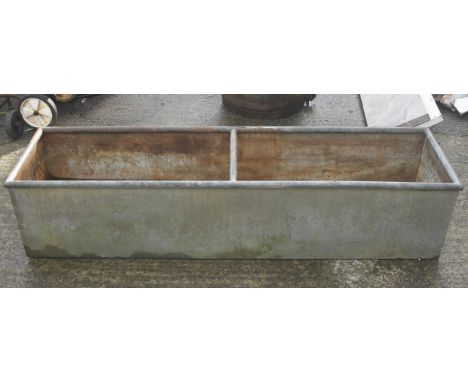 A galvanized metal water trough. Is watertight with bracer bar in centre, H40cm x L190cm x W40cm. 