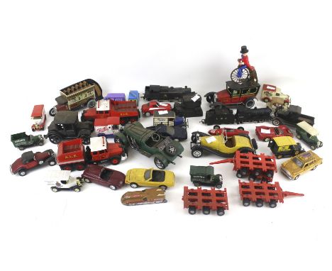 An assortment of diecast and model vehicles. Including a Tri-ang OO gauge locomotive, Matchbox 'Models of Yesteryear', tinpla