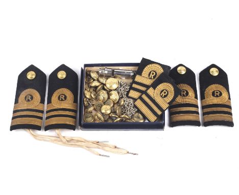 A collection of assorted Gieves military buttons, naval epaulettes and a whistle.