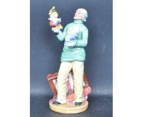 A vintage 20th century ceramic porcelain Royal Doulton character figure entitled 'Punch and Judy Man' HN2765. The figurine de