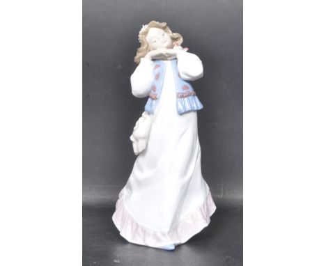 A ceramic porcelain Spanish Lladro hand painted figurine entitled 'Dreams Of Summer Past'. Figure model number 6401. &nbsp;Co