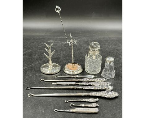A quantity of hallmarked Silver to include 7 button hooks, a nail file, a hat pin, a ring tree, a hat pin holder 10cm h and t