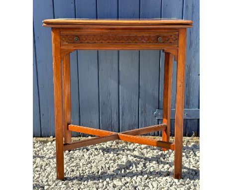 An early 20thC mahogany fold over card table with single drawer to front and blind fretwork decoration to three sides and 2 b