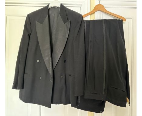 Vintage gents black evening jacket with wide lapels and two pairs of trousers. Chest 54cm, inside leg 80cm approx. 