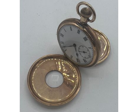 A gold plated half hunter pocket watch with subsidiary seconds dial and black enamelled Roman chapter ring to front case. 5cm