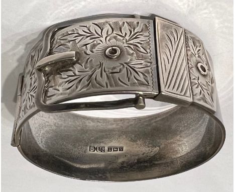 A hallmarked silver buckle bangle. Birmingham 1962, maker Bracelon Ltd. Weight 67.9gm. 