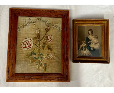 A fine Georgian embroidery depicting a stem of roses below a foliage garland in a contemporary frame together with a print of