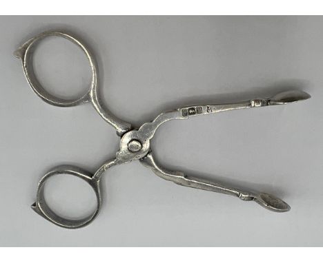 A pair of hallmarked silver sugar nips of diminutive proportions, 8cms long. Sheffield 1902 maker James Deakin &amp; Sons. We