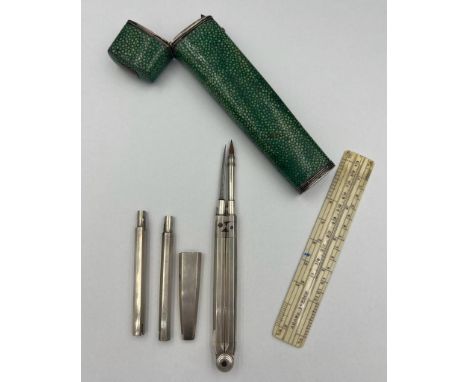 An early 19thC shagreen cased draughtsman’s compass set with white metal mounts. 14cm h. Ivory ruler marked Adams London. Sub