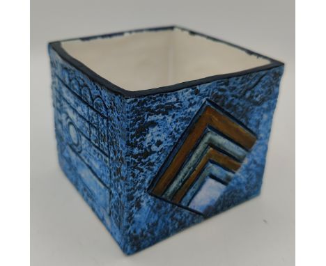 A blue square Troika vase by Simone Kilburn signed SK to bottom, with geometric shape design to all sides 8 h x 9.5 w x 9cm d