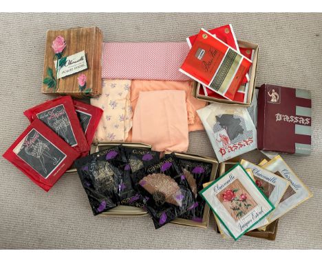 A quantity of vintage fabric to include silk together with 19 pairs of unused French vintage stockings in original packaging.