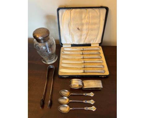 Silver and white metal to include boxed silver handled dessert knives, two napkin rings, sugar tongs, three .800 silver and e
