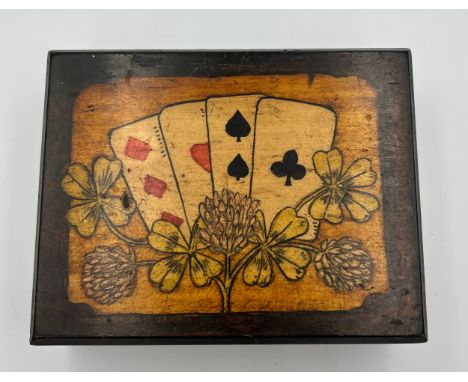 A 19thC playing card box containing two packets of Victorian playing cards. One pack Goodall London, the other commemorating 