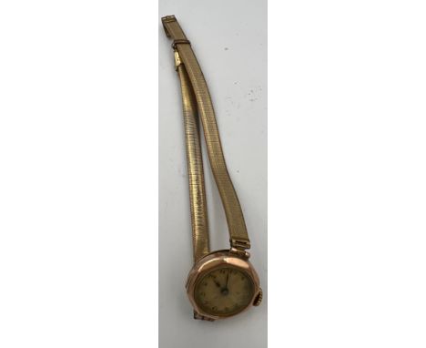 A vintage 9 carat gold cased ladies wristwatch on plated strap. Total weight 19gm. 