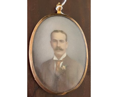 A Victorian miniature portrait, painted by A. James, 1897, of a gentleman in a tie in gilt frame, on ivory. s.s. 9 x 7cm. Sub