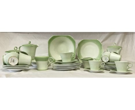 Art Deco Shelley coffee and tea services circa 1933, comprising five tea cups, six saucers, six tea plates, milk jug, tea pot