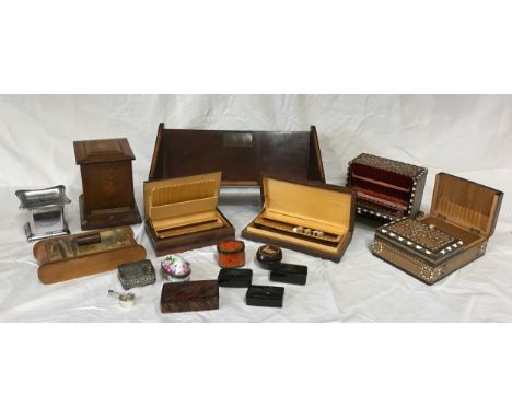 A collection of boxes to include snuff boxes/containers, cigarette boxes, an ashtray and a book trough. 
