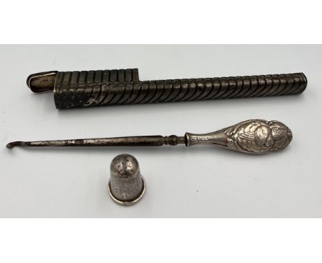 Silver to include toothbrush holder Birmingham 1888, maker George Unite and sons, a silver handled button hook Chester 1904 a