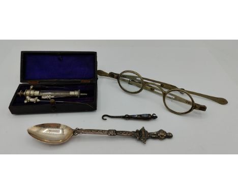 A miscellany to include a silver button hook with agate stone embellishment hallmarked Birmingham 1890, a white metal spoon w