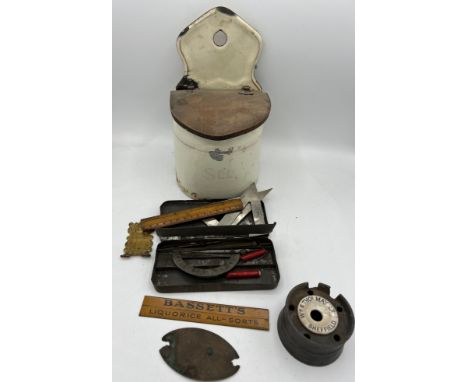 A miscellany to include French enamel wall mounted salt container, Bassett’s Liquorice All-Sorts metal ruler, metal cased ins