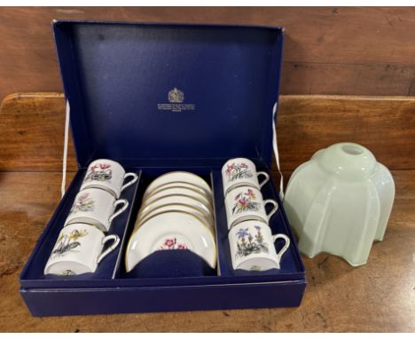 A boxed set of Royal Worcester 6 x coffee cans and saucers depicting flowers together with a vintage green glass lamp shade. 