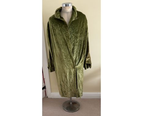 A 1920's ladies green velvet wrap robe with single covered button to the front, full length ruched sleeves, diamanté embellis