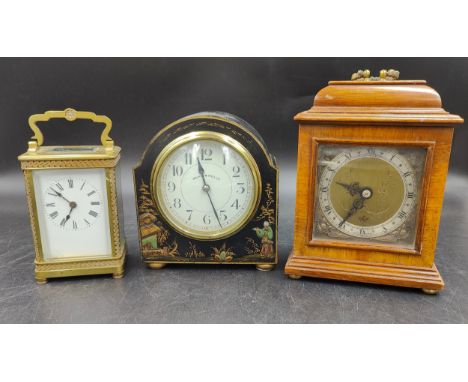 A collection of three clocks to include, a Walker &amp; Hall ltd black lacquered mantle clock with painted oriental scenes to