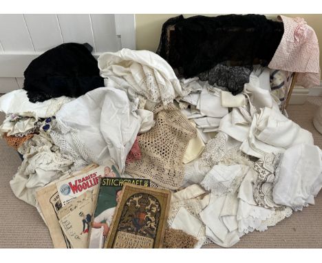 Two suitcases full of vintage fabrics, shawls, cloths, mats, doilies, crocheted work, a bonnet, patterns etc. 