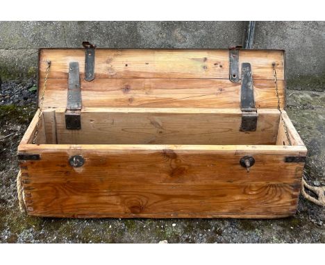 A vintage pine and metal ammunition box with rope handles. 82cm w x 20cm d x 28cm h. 