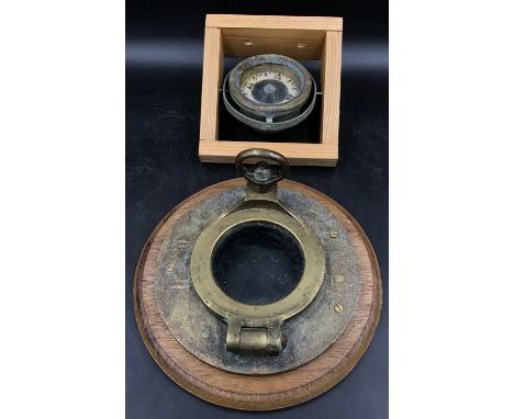Shipping interest- A wooden and brass porthole with small glass window (glass 10cm d) and a gimble mounted compass made by 'I