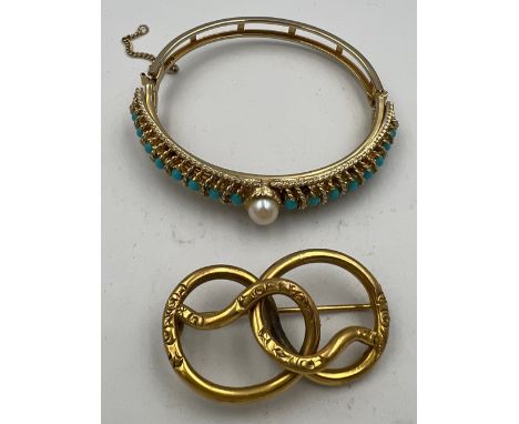 Gold plated hinged bangle together with gold plated brooch. 