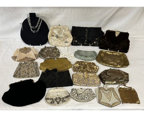A quantity of vintage evening bags and purses to include beaded, sequinned, velvet, fabric together with a corded navy bag wi